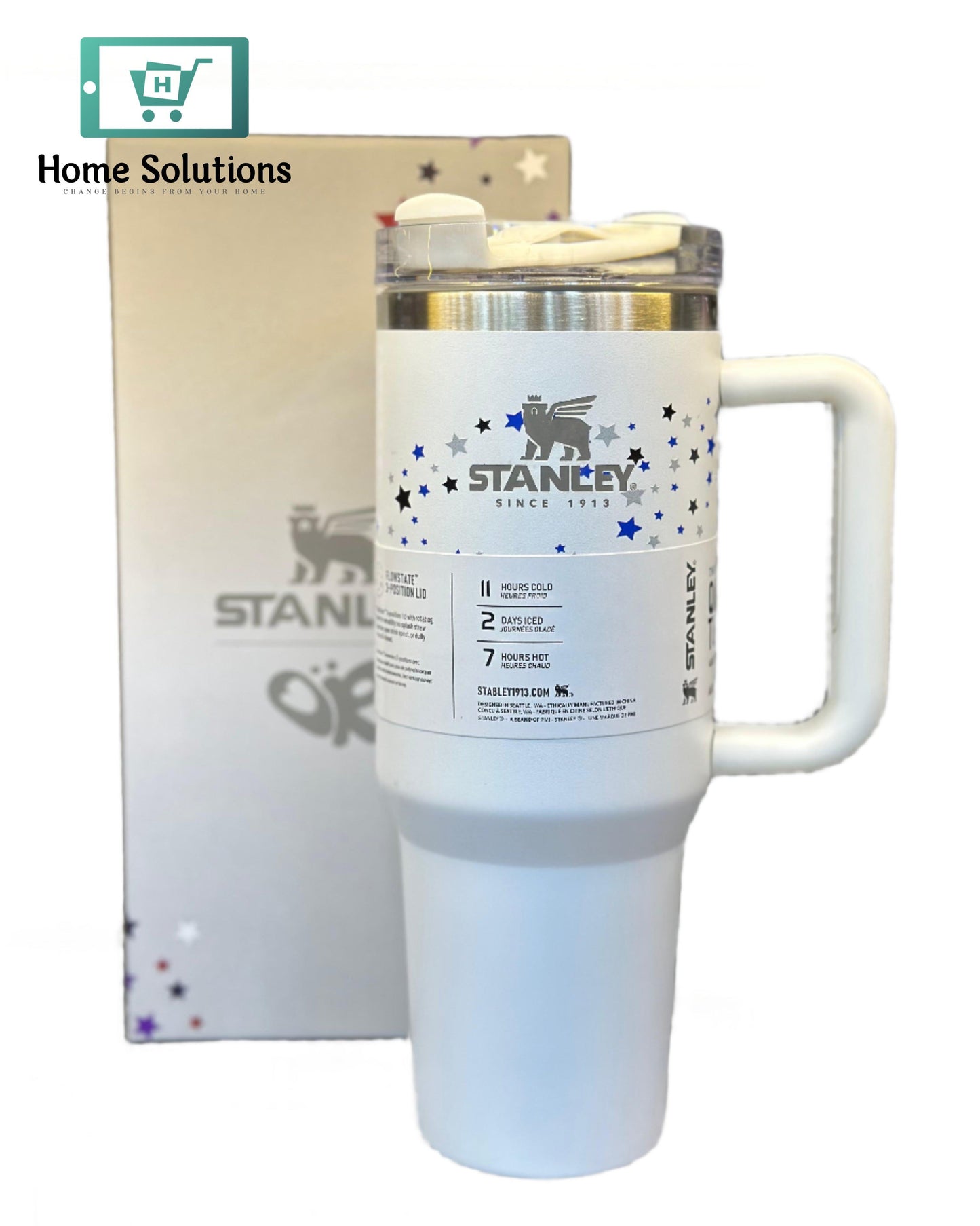 White insulated mug with handle featuring 'STANLEY' branding on a blurred background