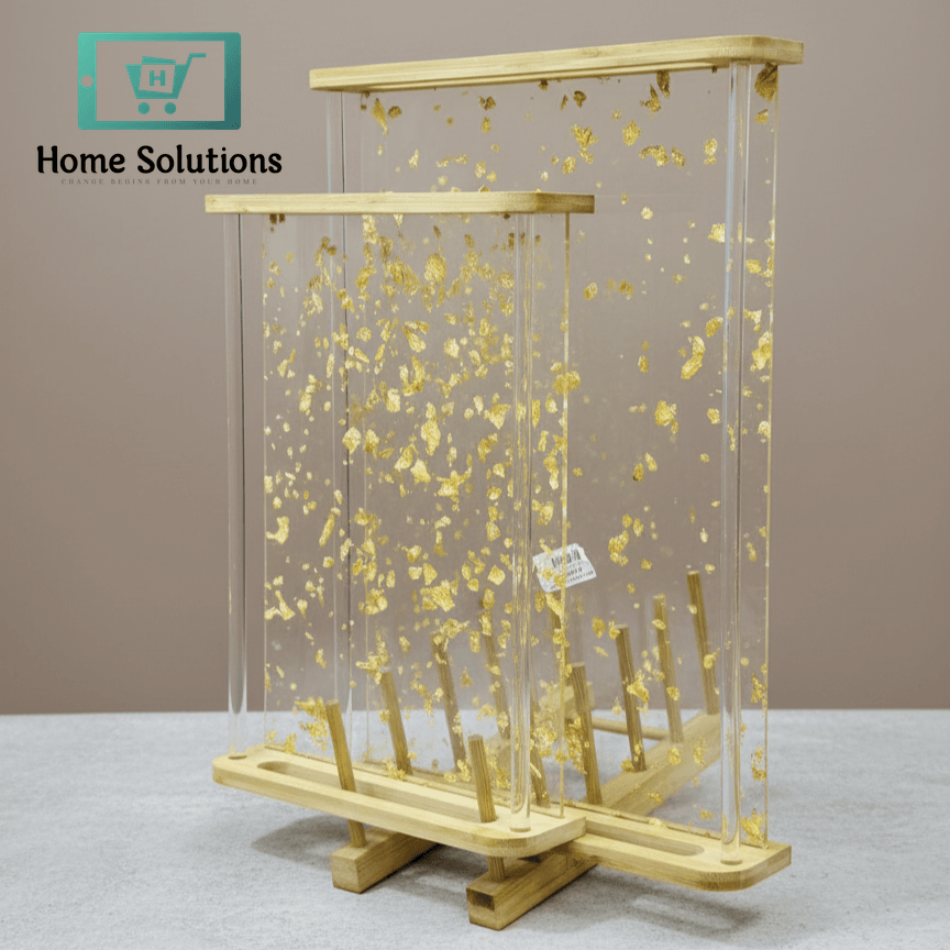 Decorative Tray set with gold leaves and clear acrylic panels on a neutral background