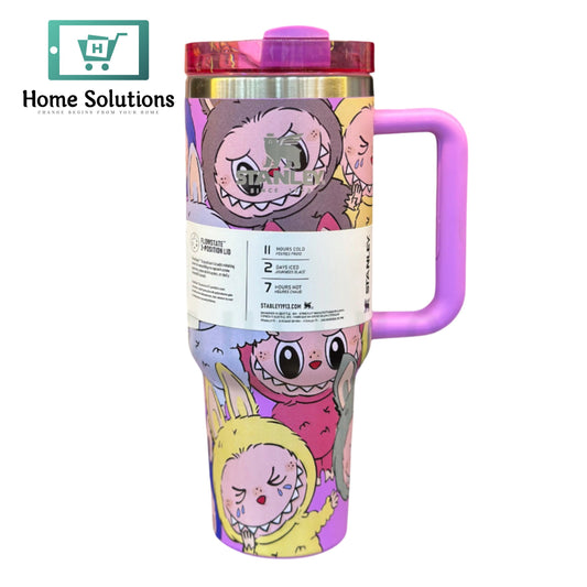 Colorful tumbler with cartoon characters on a white background, featuring the brand 'Stanley'.