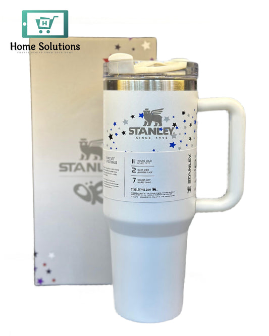 White insulated mug with handle featuring 'STANLEY' branding on a blurred background