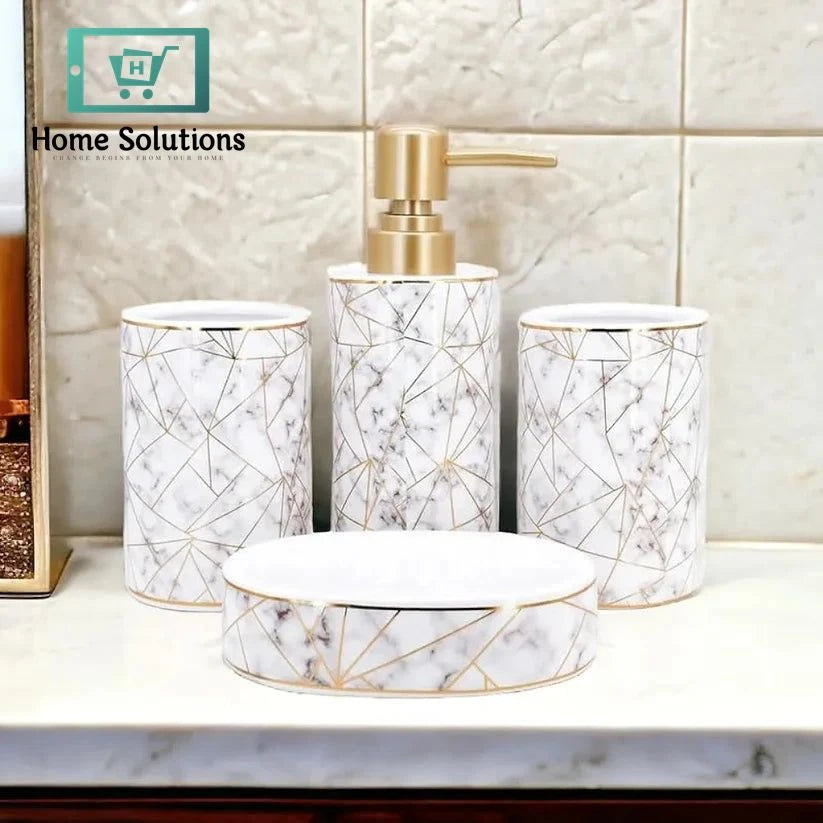 Bathroom accessories set with geometric design on a marble countertop.