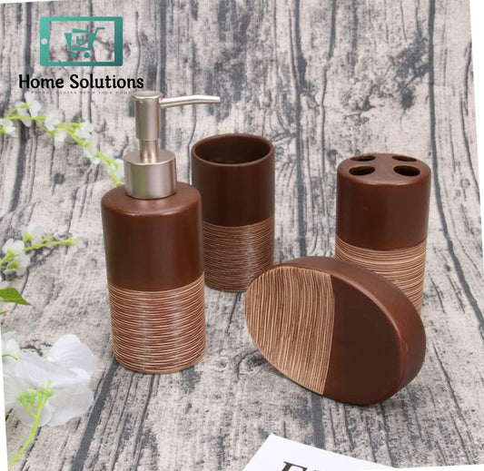 Brown bathroom accessory set with dispenser, cups, and soap dish on a textured surface.