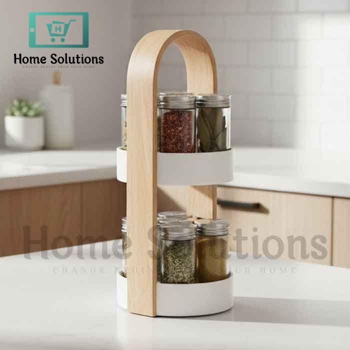 Wooden two-tier spice rack for Pakistani kitchen with 12 glass jars and stainless steel lids, showing modern countertop organization.

