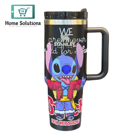 Travel mug with cartoon character design on a white background, featuring the brand 'Stanley'.