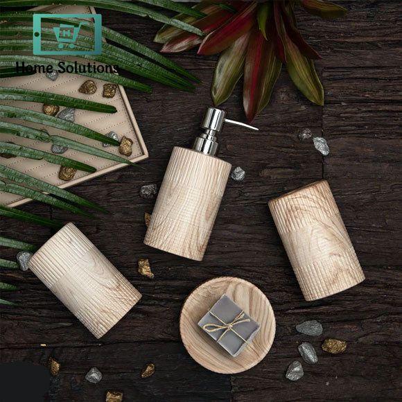 Set of four ceramic bathroom accessories with textured design on a light background, labeled 'Home Solutions'.
