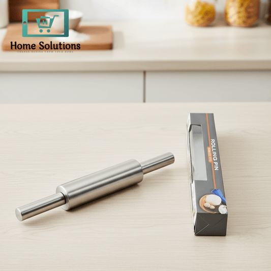 Stainless steel rolling pin on a kitchen counter with packaging