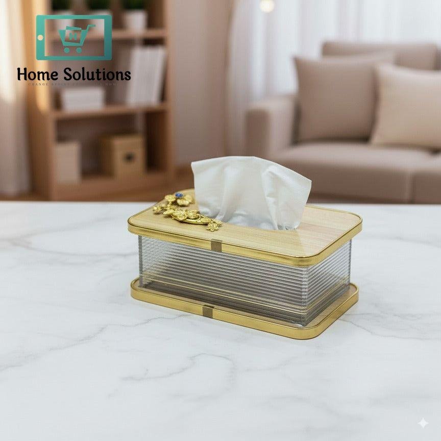 Premium Wood Top Gilded Tissue Box with Metal Motif 3 Decorative tissue box on a table with a blurred background of a living room.
