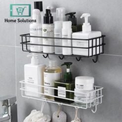 Bathroom shelves with various bottles and containers on a gray tiled wall.