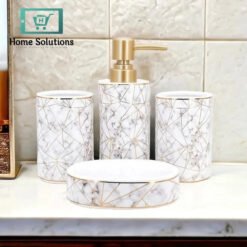 4-Piece Ceramic Bathroom Accessories Set – Marble Design 7 Bathroom accessories set with geometric design on a marble countertop.