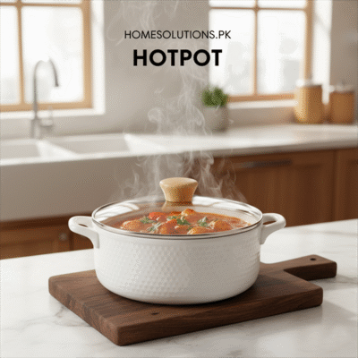 Homesolutionspk Hotpot category image showcasing a white, textured hotpot with steaming food on a wooden board in a modern kitchen.