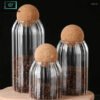 Transparent vertical textured glass jar with airtight cork ball lid