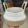 Beige and white cotton rope woven storage basket with loop handles
