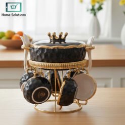 Black ceramic soup set with golden stand and handles, displayed on glass shelf — luxury soup serving set 16 pcs.