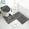 3-piece bathroom mat set with a soft bath mat, contour rug, and toilet lid cover in matching design, non-slip and absorbent for everyday bathroom use.