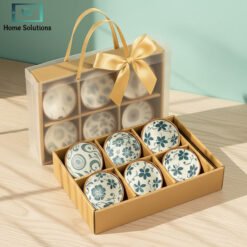 Elegant Japanese ceramic bowls set with golden ribbon bag