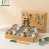 Elegant Japanese ceramic bowls set with golden ribbon bag