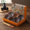 Elegant Japanese ceramic bowls set with golden ribbon bag