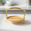 Luxury bamboo serving platter with golden petal handle stand on a kitchen counter