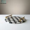 Black and white striped round marble tray with gold handles