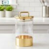 "CrystalClear acrylic airtight food canister with transparent body and gold handle lid for kitchen storage jar"