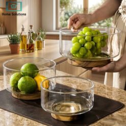 Large glass fruit bowl with wooden base