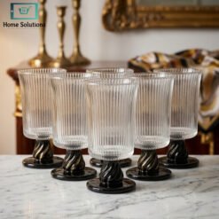 ribbed glass set with black pedestal base