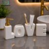 Brilliant Luxury Bathroom Accessory Set - White 1 Brilliant luxury bathroom accessory set with modern ceramic LOVE design and gold accents for elegant bathroom décor