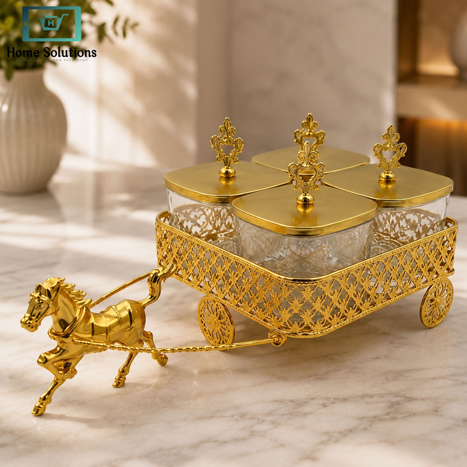 Luxury Candy Glass Jar Set 4 Pcs with Gold Horse Carriage Stand 2 Luxury 4-piece clear Candy Glass Jar Set with decorative gold lids and elegant horse carriage metal stand for serving dry fruits, chocolates, candies and snacks.